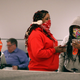 Travelers wait for luggage wearing face protection at Sky Harbor Airport on March 12, 2020 in Phoenix, Arizona.